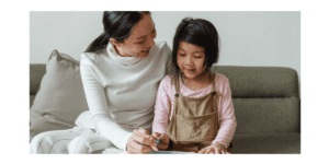 mom working with daughter on school
